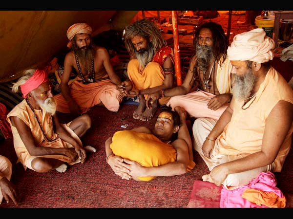 A boy sadhu performing Yoga