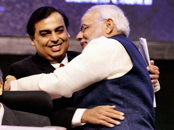 Narendra Modi hugs Mukesh Ambani