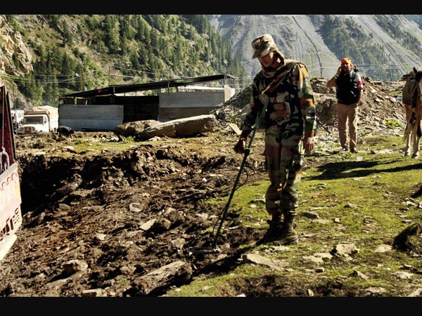 Army man checks a base camp
