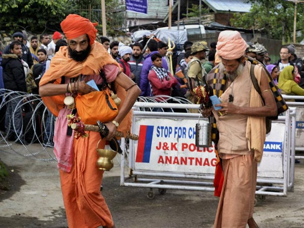 Sadhus walk towards the holy shrine of Amarnath