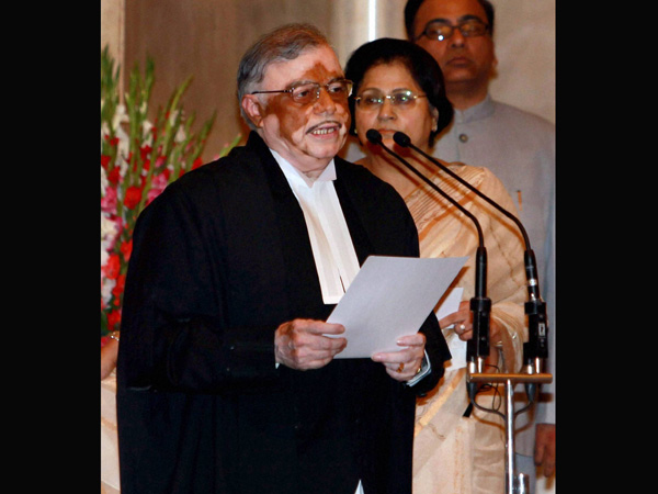 Sathasivam takes the oath of office at a ceremony
