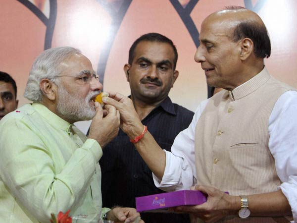 Modi, Rajnath distribute sweets