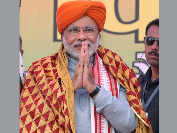 Narendra Modi is felicitated at an election rally