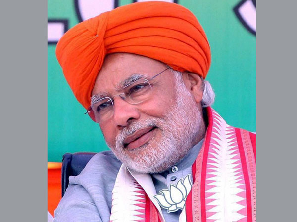 Narendra Modi wears a turban at an election rally