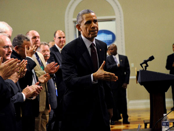 President Barack Obama walks over to shake hands