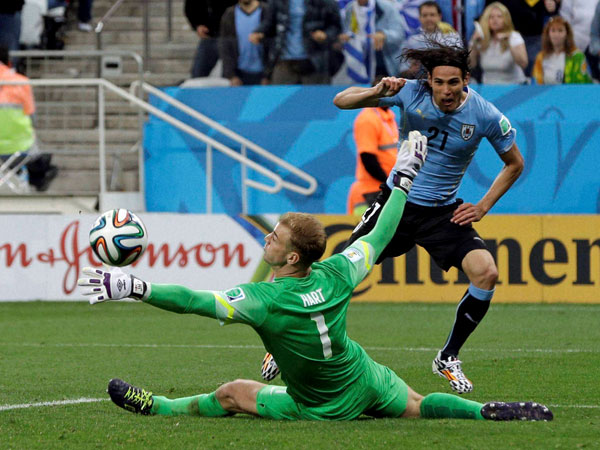Uruguay's Edinson Cavani misses a chance as England's goalkeeper