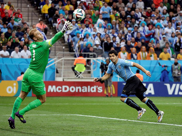 England's goalkeeper Joe Hart can't stop Uruguay's Luis Suarez's header