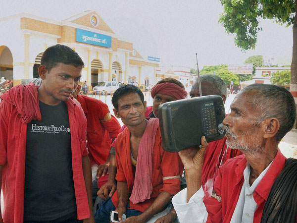 Coolies in Moradabad Railway Station listening to Railway Budget speech