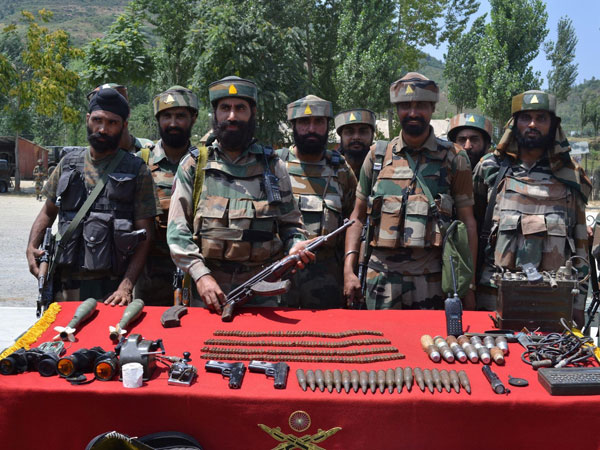 Security personnel display arms, ammunition