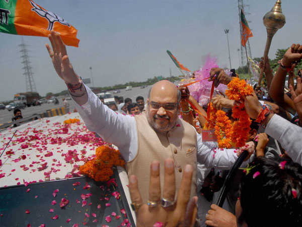 BJP President Amit Shah being greeted by party workers