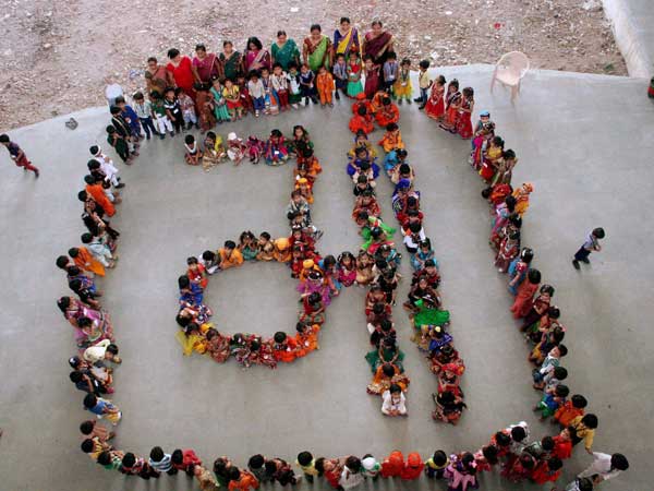 School children make a formation which represents the word Maa