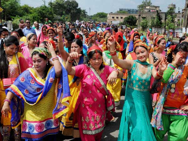 Nepali women participate in a rally as they celebrate