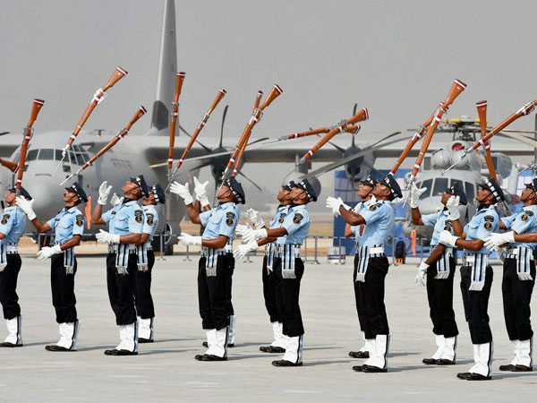 ir Force personnel perform with guns