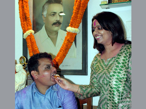 BJP Maharashtra President Devendra Fadnavis being offered sweets