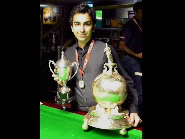 Pankaj with his double world billiards titles Pankaj with his double world billiards titles
