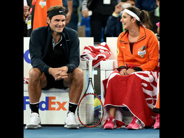 Federer and Sania share a light moment during their mixed doubles match Federer and Sania share a light moment during their mixed doubles match