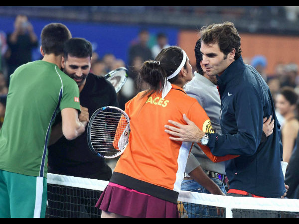 Roger Federer hugs Sania Mirza while Novak Djokovic hugs Bollywood actor Akshay Kumar during IPTL match in New Delhi on Monday. Roger Federer hugs Sania Mirza while Novak Djokovic hugs Bollywood actor Akshay Kumar during IPTL match in New Delhi on Monday.