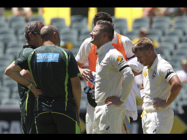Clarke, second from right, grimaces in pain after injuring himself Clarke, second from right, grimaces in pain after injuring himself