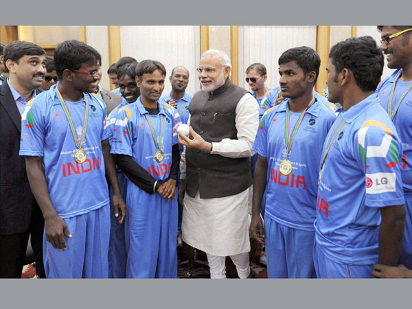 PM Narendra Modi with the Indian team PM Narendra Modi with the Indian team