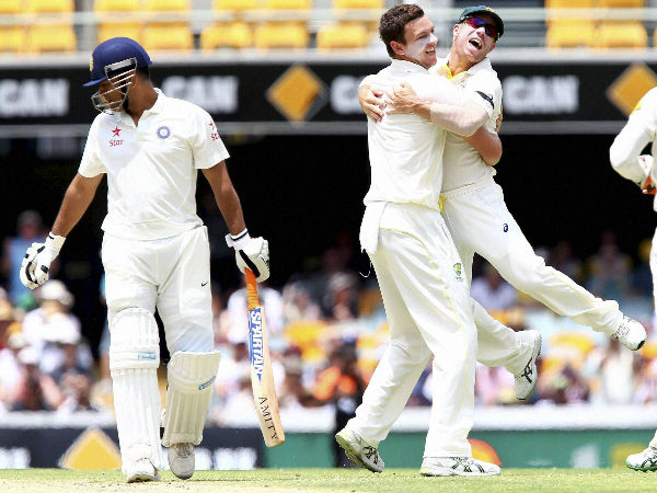 Josh Hazlewood, centre, celebrates with David Warner after getting the wicket of Dhoni Josh Hazlewood, centre, celebrates with David Warner after getting the wicket of Dhoni