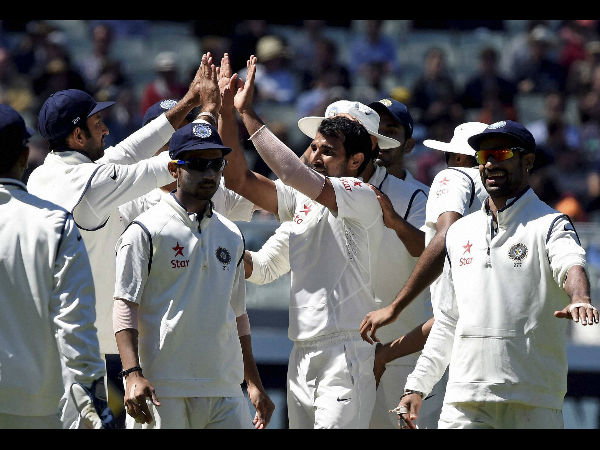 Shami (right, giving high fives) celebrates with team-mates after dismissing Shaun Marsh Shami (right, giving high fives) celebrates with team-mates after dismissing Shaun Marsh