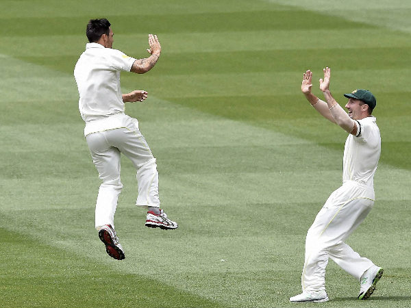 Mitchell Johnson (left) celebrates with Shaun Marsh after dismissing KL Rahul Mitchell Johnson (left) celebrates with Shaun Marsh after dismissing KL Rahul