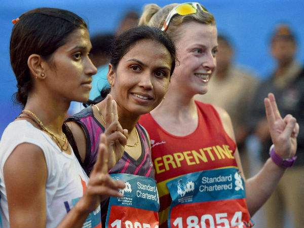 From left: Supriya Patil, Kavita Raout and Eve Bugler flash victory signs after winning the marathon From left: Supriya Patil, Kavita Raout and Eve Bugler flash victory signs after winning the marathon