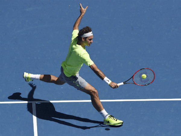 Federer makes a backhand return to Seppi during their third round match Federer makes a backhand return to Seppi during their third round match