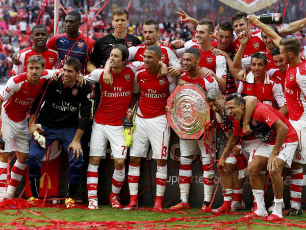 Arsenal's celebrate their win against Manchester City with the trophy at the end of their English Community Shield match Arsenal's celebrate their win against Manchester City with the trophy at the end of their English Community Shield match