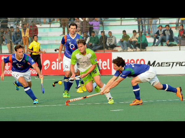 Delhi (blue) and Uttar Pradesh players in action during the match Delhi (blue) and Uttar Pradesh players in action during the match