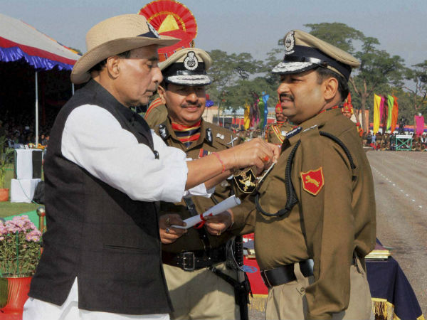 Home Minister Rajnath Singh presenting the President's police medal to a BSF officer during the 49th Raising Day function of BSF in New Delhi on Jan 12, 2015. Home Minister Rajnath Singh presenting the President's police medal to a BSF officer during the 49th Raising Day function of BSF in New Delhi on Jan 12, 2015.