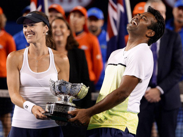 Martina Hingis of Switzerland (left) and Leander Paes of India (right) hold trophy at the Australian Open Martina Hingis of Switzerland (left) and Leander Paes of India (right) hold trophy at the Australian Open