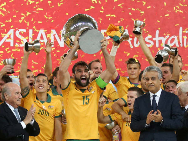 Australian football team celebrate with their trophy Australian football team celebrate with their trophy