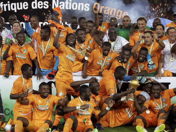 Ivory Coast soccer players celebrate with the trophy after winning their African Cup of Nations final match against Ghana Ivory Coast soccer players celebrate with the trophy after winning their African Cup of Nations final match against Ghana