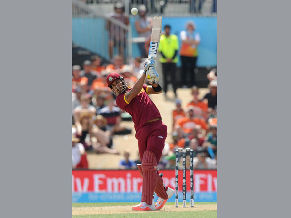Lendl Simmons hits the ball to the boundary Lendl Simmons hits the ball to the boundary