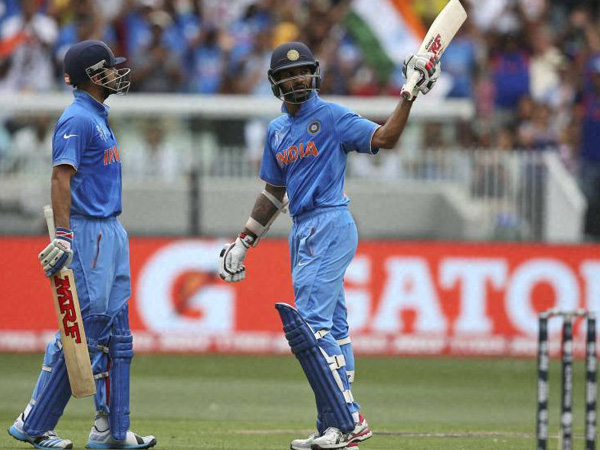 Shikhar Dhawan (right) gets to 50 and goes on to score 137 Shikhar Dhawan (right) gets to 50 and goes on to score 137
