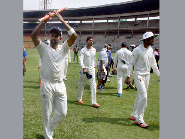 Vinay (left) and his team-mates return to pavilion after winning the match Vinay (left) and his team-mates return to pavilion after winning the match