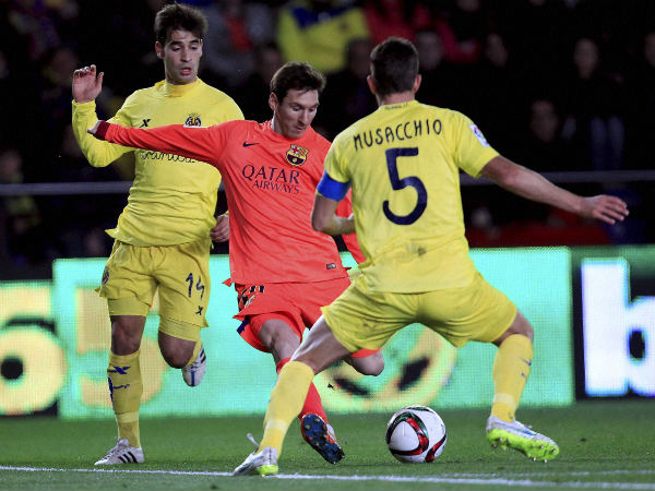 Lionel Messi (centre) of Barcelona in action against Villarreal Lionel Messi (centre) of Barcelona in action against Villarreal