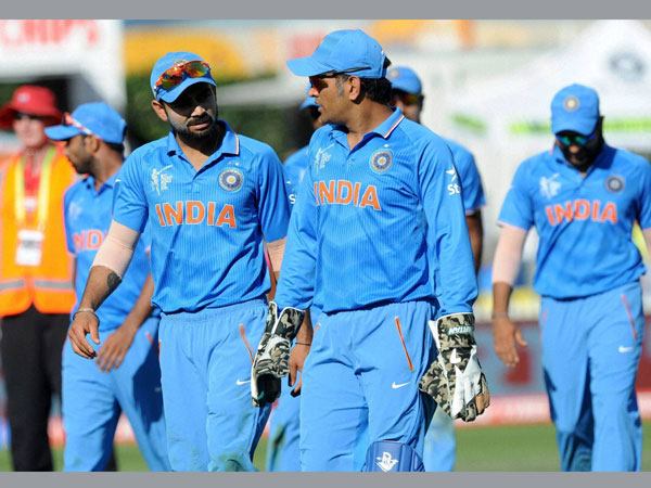 Indian captain MS Dhoni (right) walks with teammate Virat Kohli from the field after they dismissed Ireland for 259 runs Indian captain MS Dhoni (right) walks with teammate Virat Kohli from the field after they dismissed Ireland for 259 runs