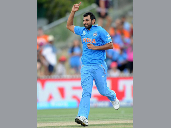 Shami celebrates after taking a wicket of Ireland batsman Shami celebrates after taking a wicket of Ireland batsman