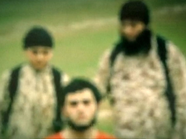 IS video shows child jihadi killing Israeli spy IS video shows child jihadi killing Israeli spy