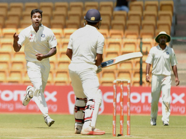 Varun Aaron (left) celebrates the wicket of Karnataka's Mayank Agarwal (centre) Varun Aaron (left) celebrates the wicket of Karnataka's Mayank Agarwal (centre)