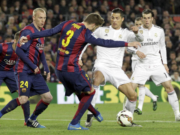 Barcelona and Real Madrid players in action in La Liga Barcelona and Real Madrid players in action in La Liga