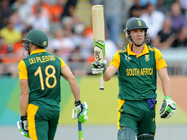 De Villiers (right) raises his bat after scoring a half century in the semi-final De Villiers (right) raises his bat after scoring a half century in the semi-final