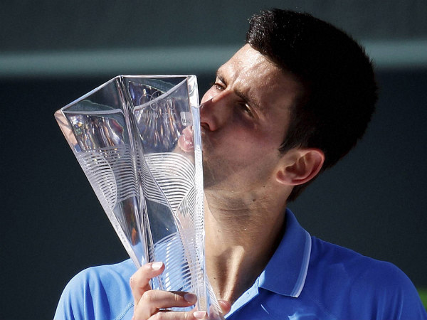 Novak Djokovic kisses the trophy after he defeated Andy Murray in the men's final of Miami Open Novak Djokovic kisses the trophy after he defeated Andy Murray in the men's final of Miami Open