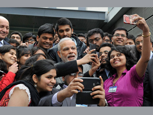 When PM Modi took selfie with Indian students in France. When PM Modi took selfie with Indian students in France.