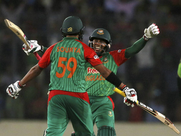 Mushfiqur Rahim, face to camera, and Soumya Sarkar prepare to embrace after winning Mushfiqur Rahim, face to camera, and Soumya Sarkar prepare to embrace after winning