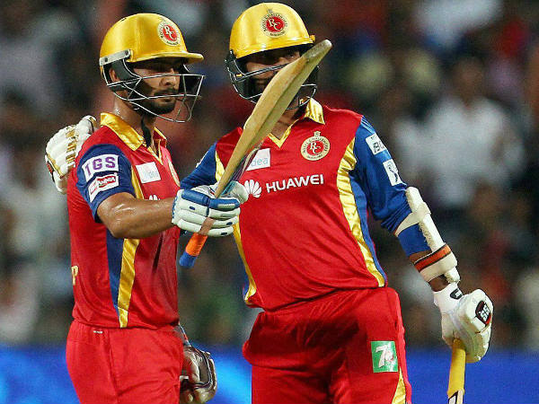Mandeep (left) celebrates his half century as Dinesh Karthik looks on Mandeep (left) celebrates his half century as Dinesh Karthik looks on