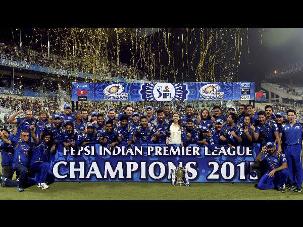 MI players, owner and support staff celebrate with the trophy MI players, owner and support staff celebrate with the trophy
