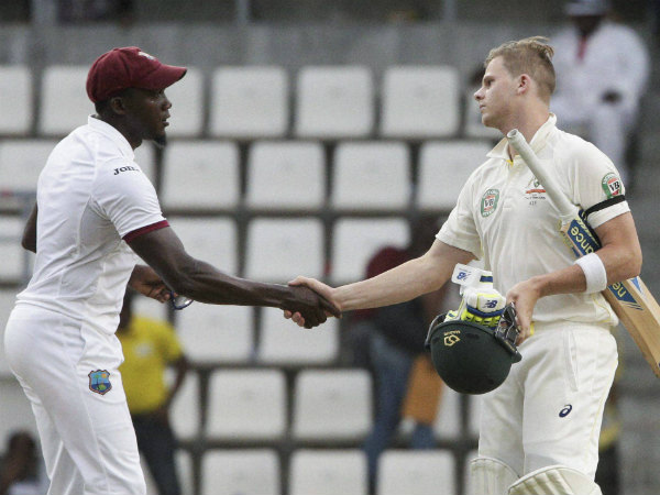 Jerome Taylor, left, shakes hands with Steve Smith at the end of their first Test Jerome Taylor, left, shakes hands with Steve Smith at the end of their first Test